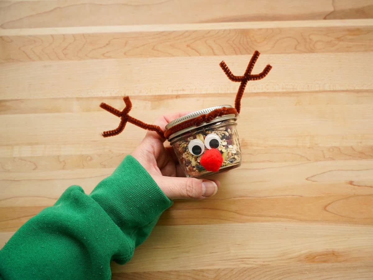 reindeer mason jar craft filled with reindeer food in a person's hand