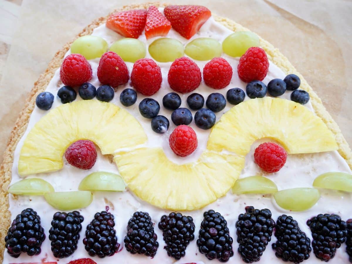 Copy of close up of fruit placed on top of easter egg fruit pizza