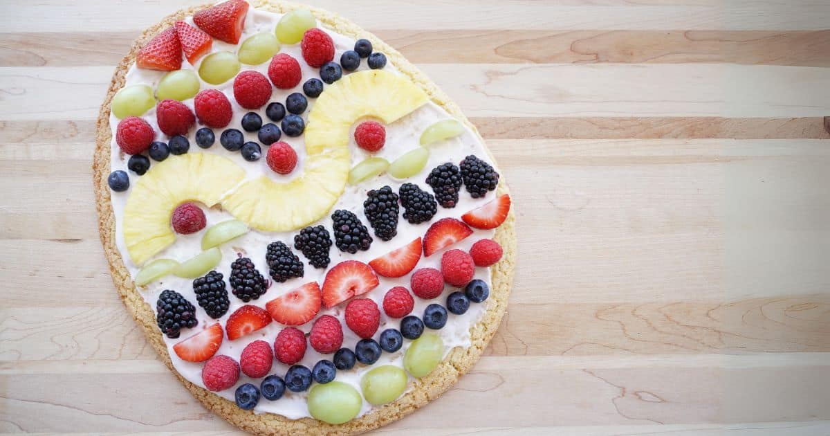 easter egg fruit platter easter egg shaped cookie pizza covered with fruit