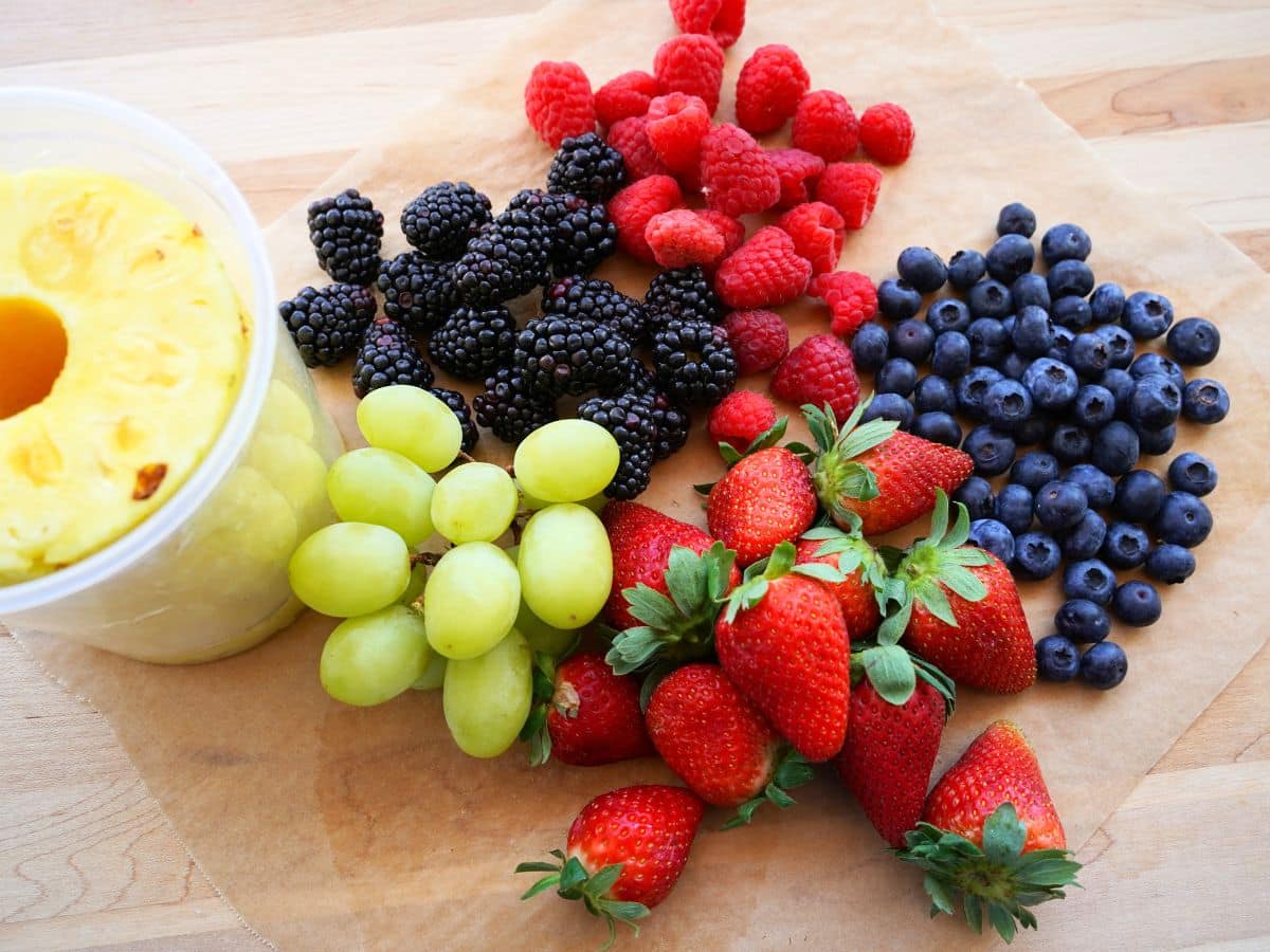 fruit for easter egg fruit tray - pineapple, raspberries, blueberries, blackberries, grapes and strawberries