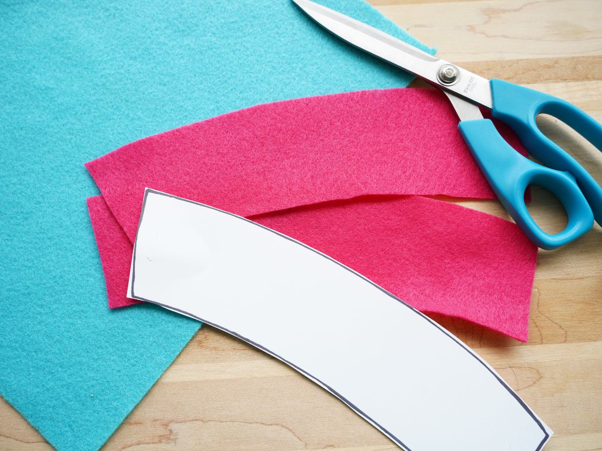 coffee sleeve template printed and cut out with pair of scissors and felt