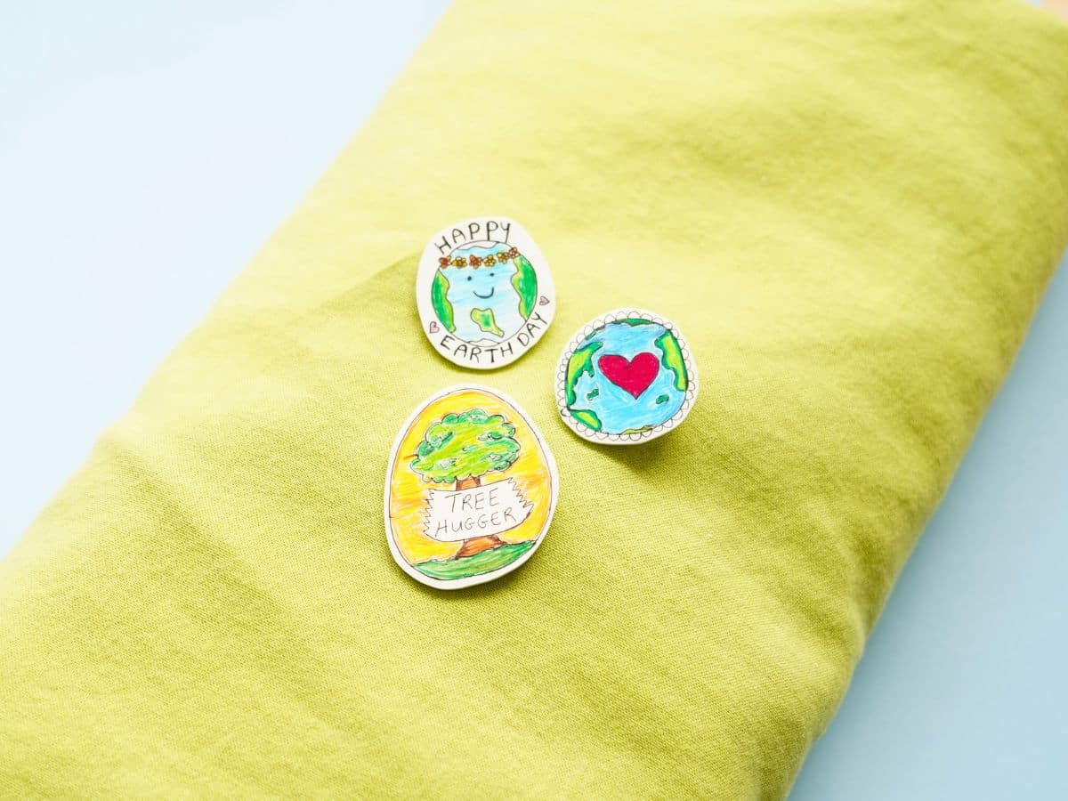 diy earth day pins pinned to green sleeve