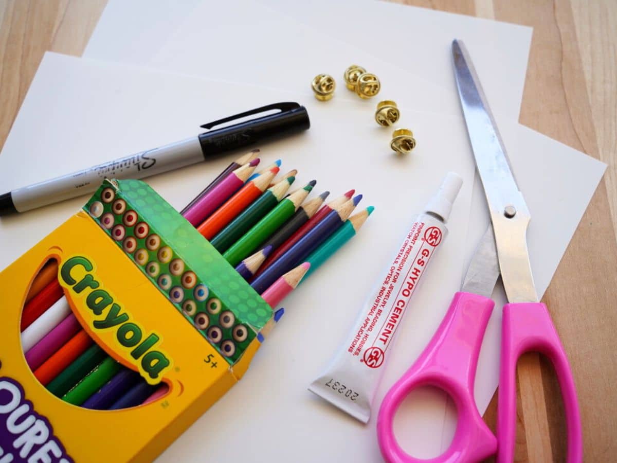 diy earth day craft supplies, marker, scissors, pencil crayons, shrink paper