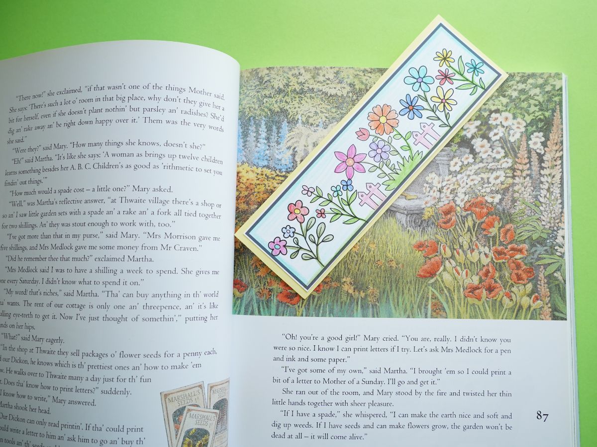 bookmark with flowers colored and inside the secret garden book