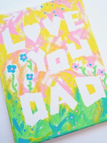featured image finished father's day tape resist canvas art on white background