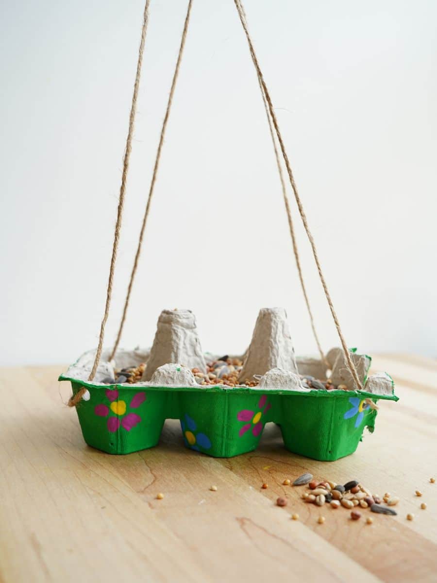 diy hanging egg carton bird feeder done and filled with birdseed