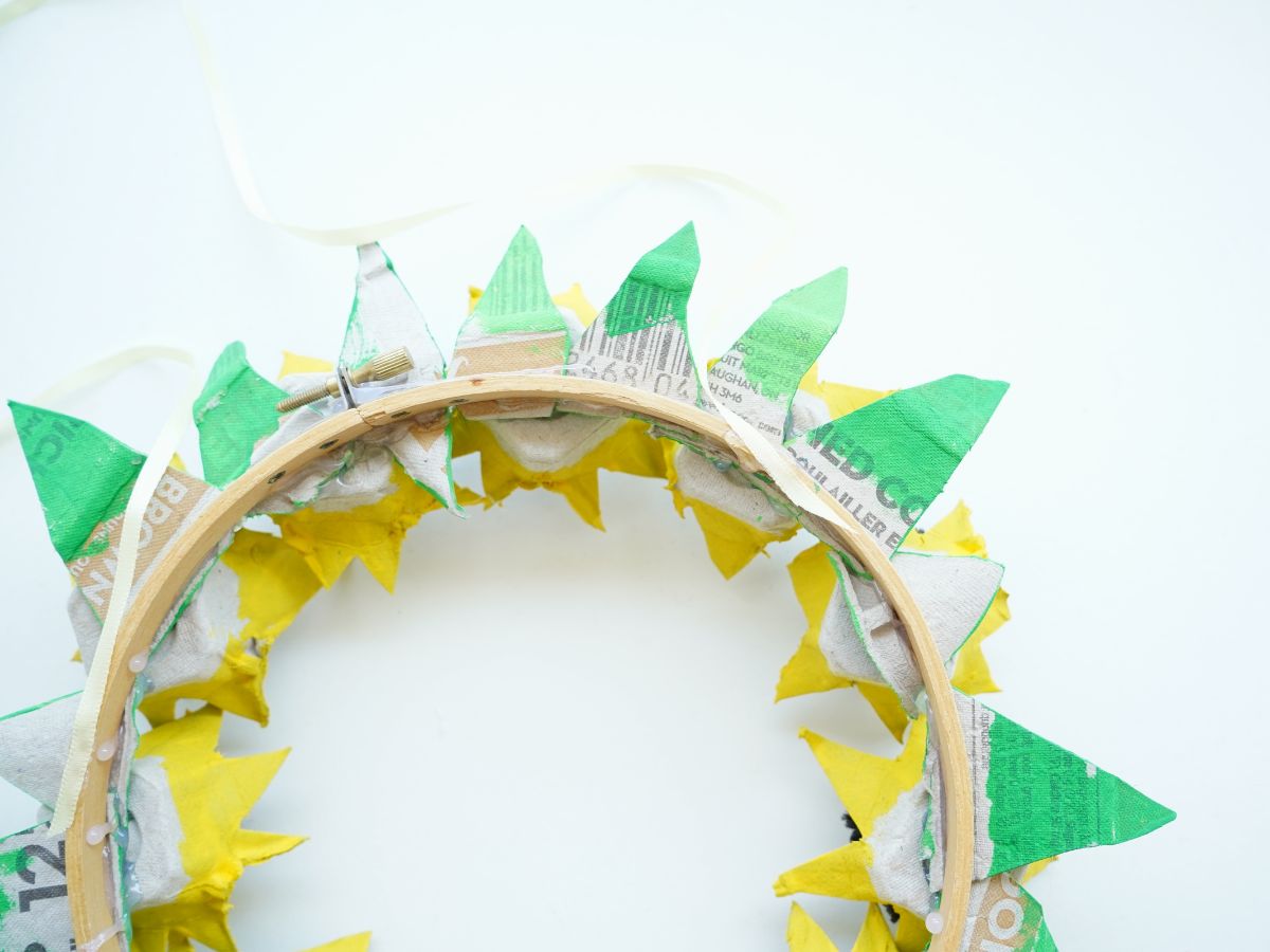 backside of egg carton flower wreath with ribbon glued in place