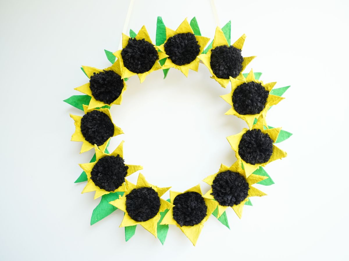 final diy egg carton sunflower wreath hanging on wall