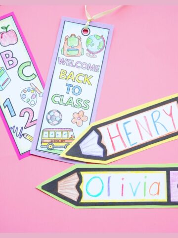 pink table with 4 printable back to school bookmarks colored on top of table