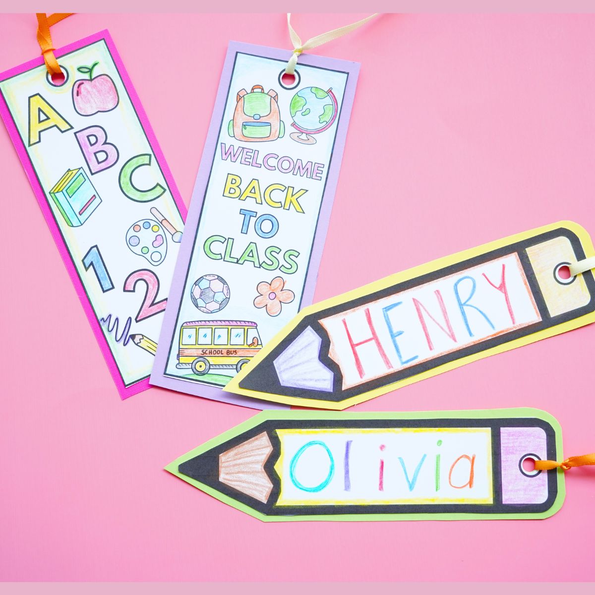 pink table with 4 printable back to school bookmarks colored on top of table
