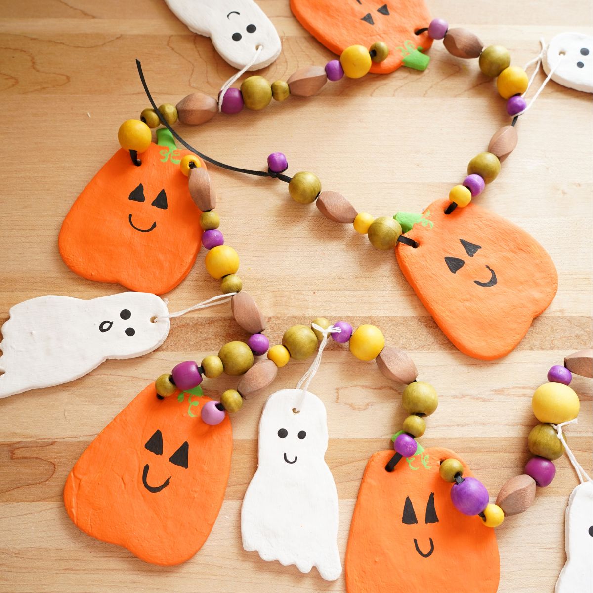 easy salt dough halloween garland with ghosts and pumpkins and wooden beads