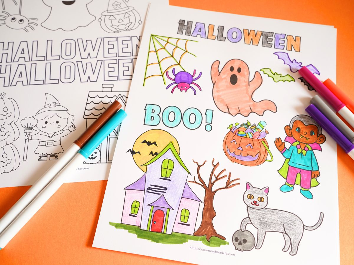 print out of Halloween coloring sheet being colored with markers