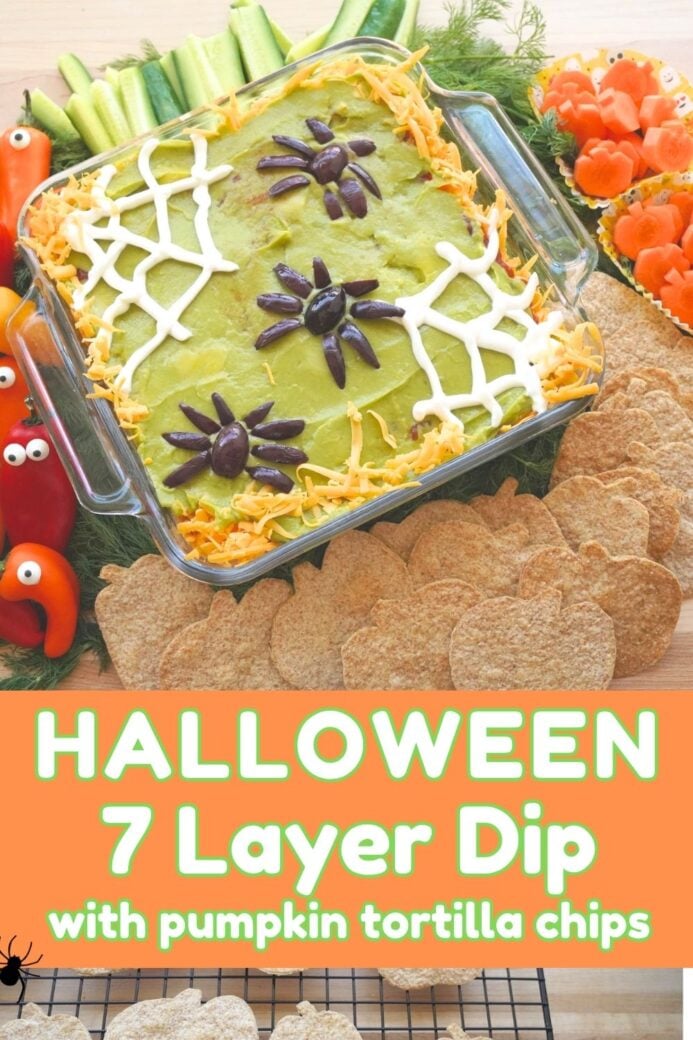 title Halloween 7-layer dip recipe with pumpkin tortilla chips and olive spiders on top