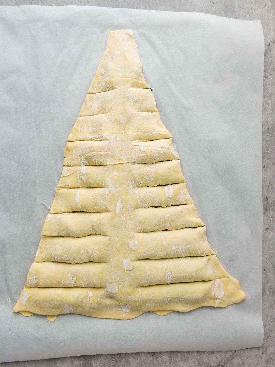 slits cut into the sides of the puff pastry christmas tree unbaked
