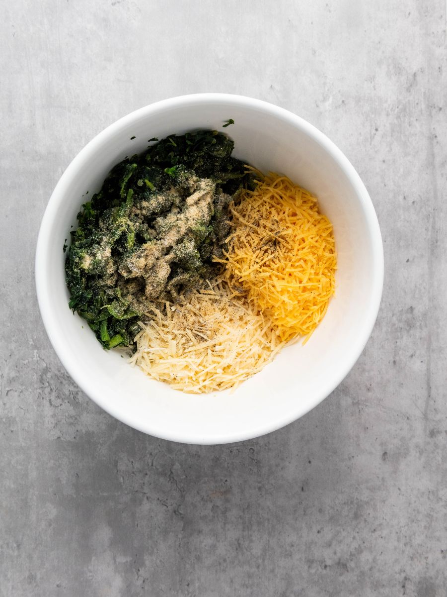 spinach dip ingredients in bowl unmixed