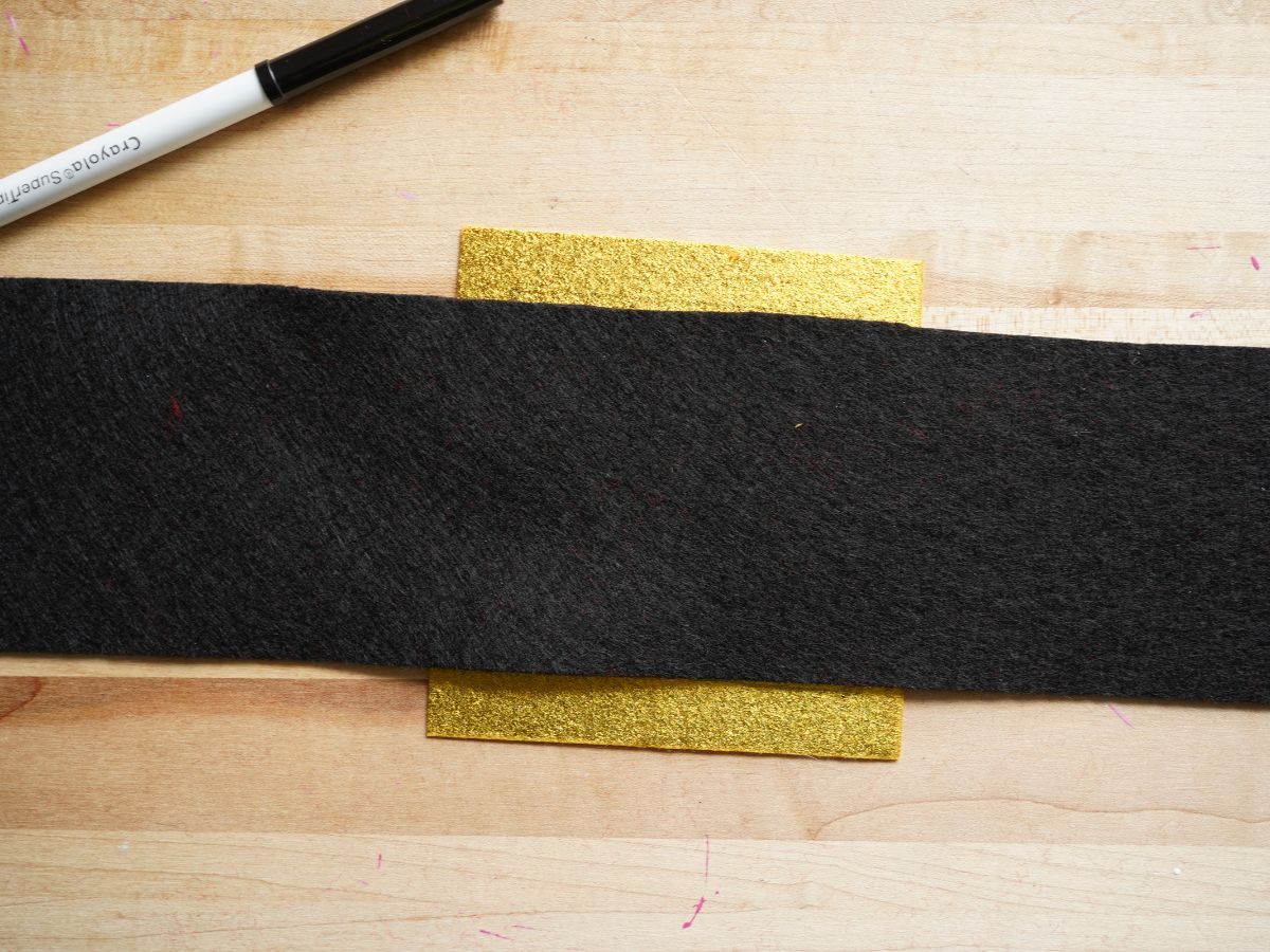 gold belt buckle felt with black belt felt strip and black marker