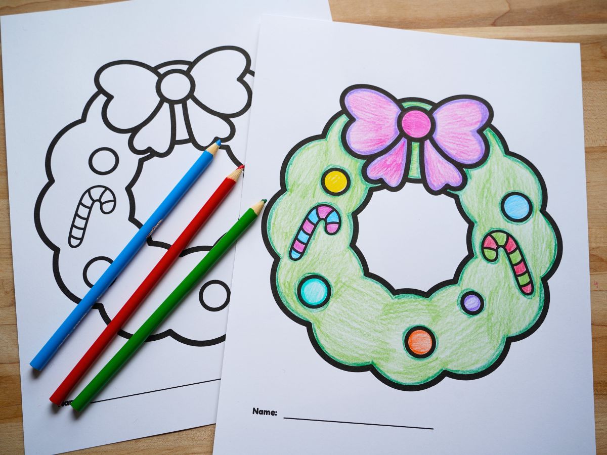 christmas wreath colouring sheet with candy canes and baubles and pencil crayons