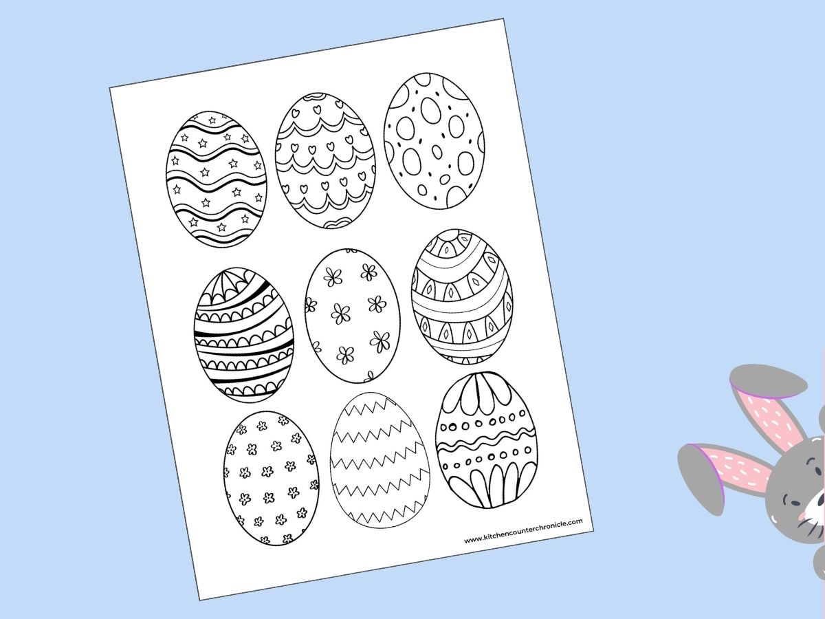 print out of coloring sheet with 9 different small easter eggs to color and a bunny poking out