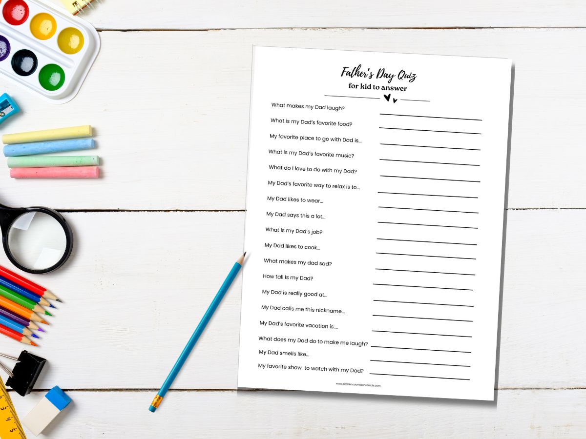 desk top with pencil and print out of father's day questionnaire for kid to answer
