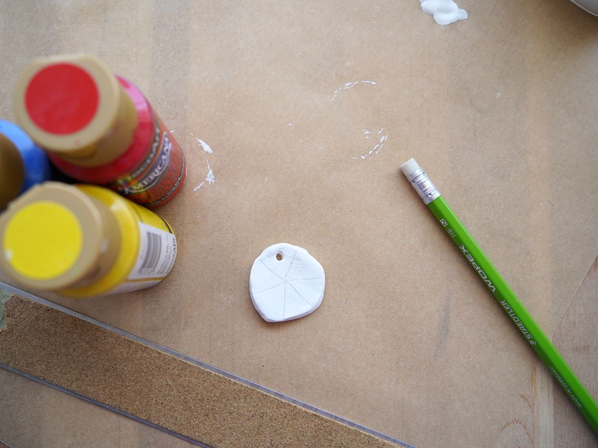 lines for color wheel design drawn on circle pendant