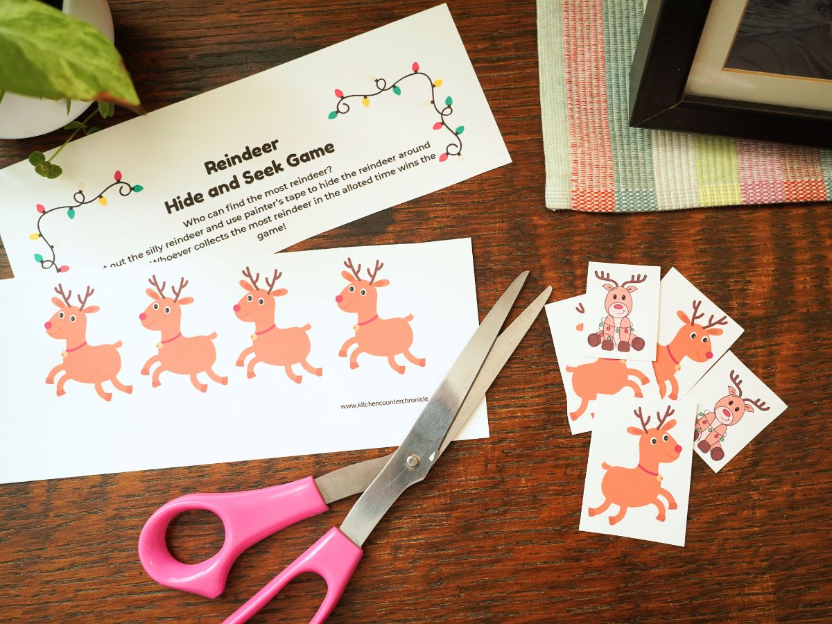 print out of reindeer hide and seek game with pair of scissors on table