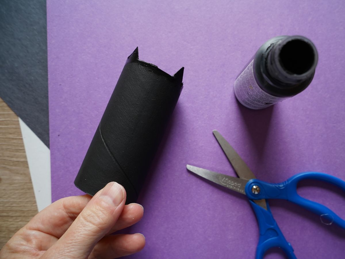 bat ears cut from black toilet roll with black paint and pair of scissors