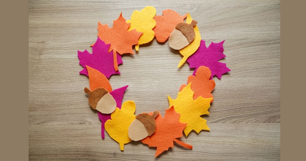 felt leaf wreath sitting on wooden table