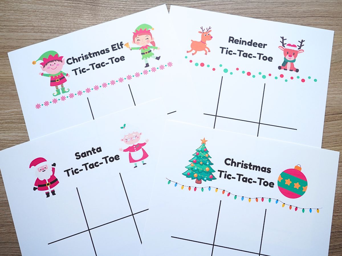 print out of 4 Christmas tic-tac-toe games on table