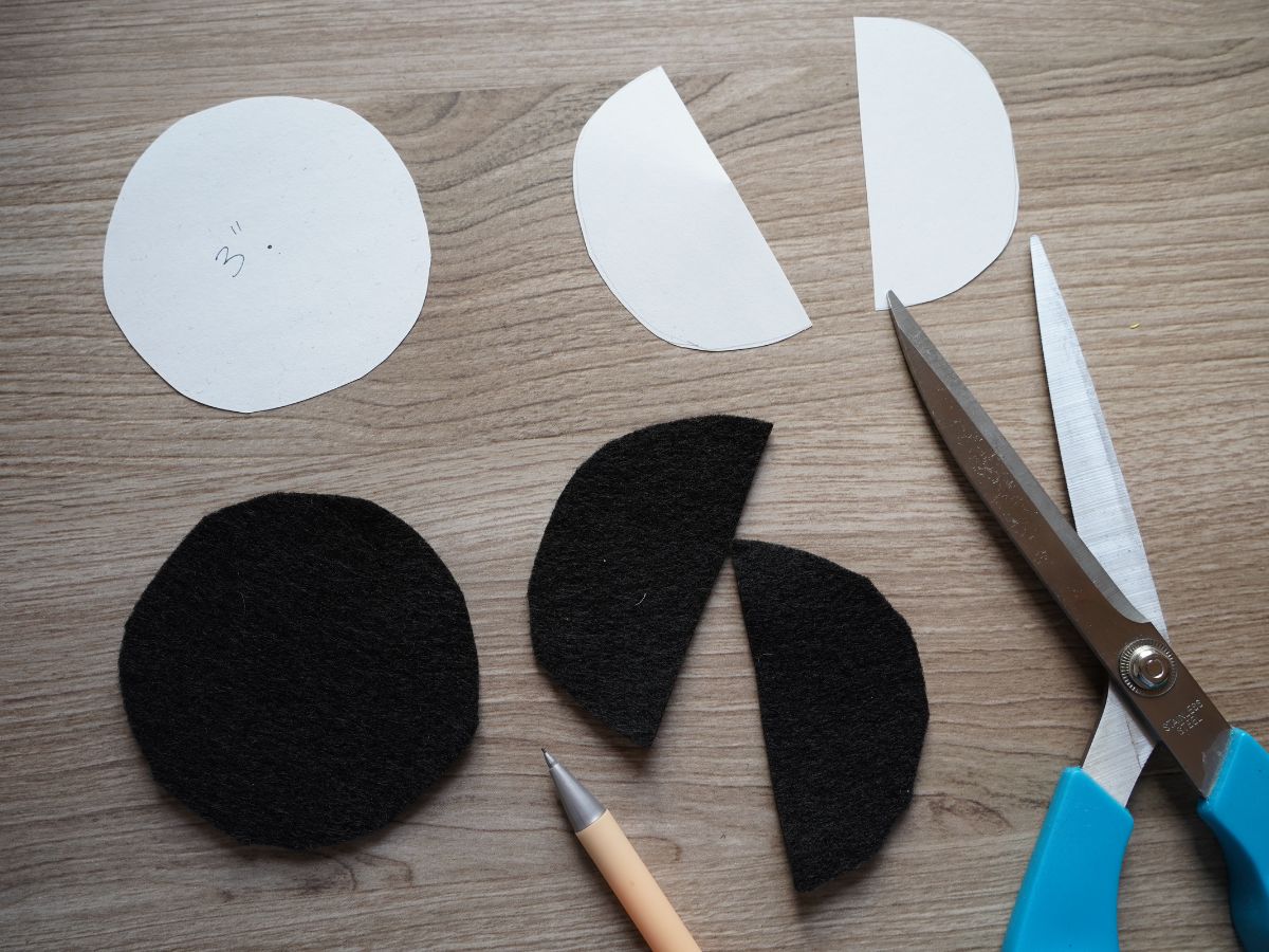 witch hat template cut from paper and pieces cut from black felt with scissors