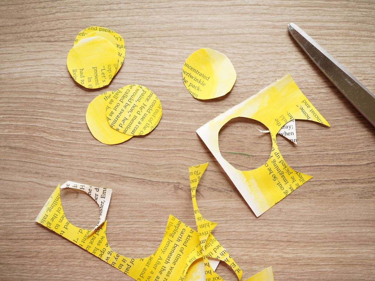 image of pages of a book painted bright yellow and cut into small circles