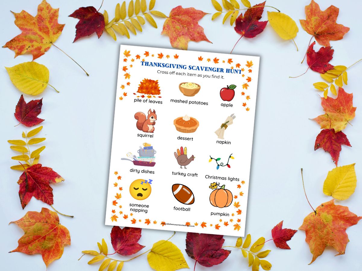 image of printable thanksgiving scavenger hunt surrounded by fall leaves
