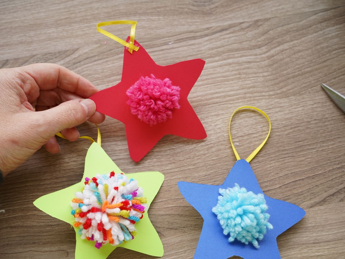 loop of yellow ribbon glued onto top of paper star ornament