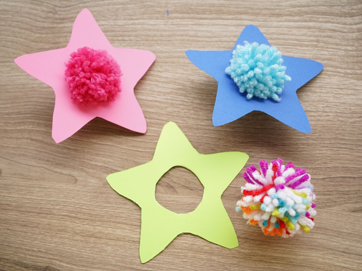 paper stars with pom poms in middle (1)
