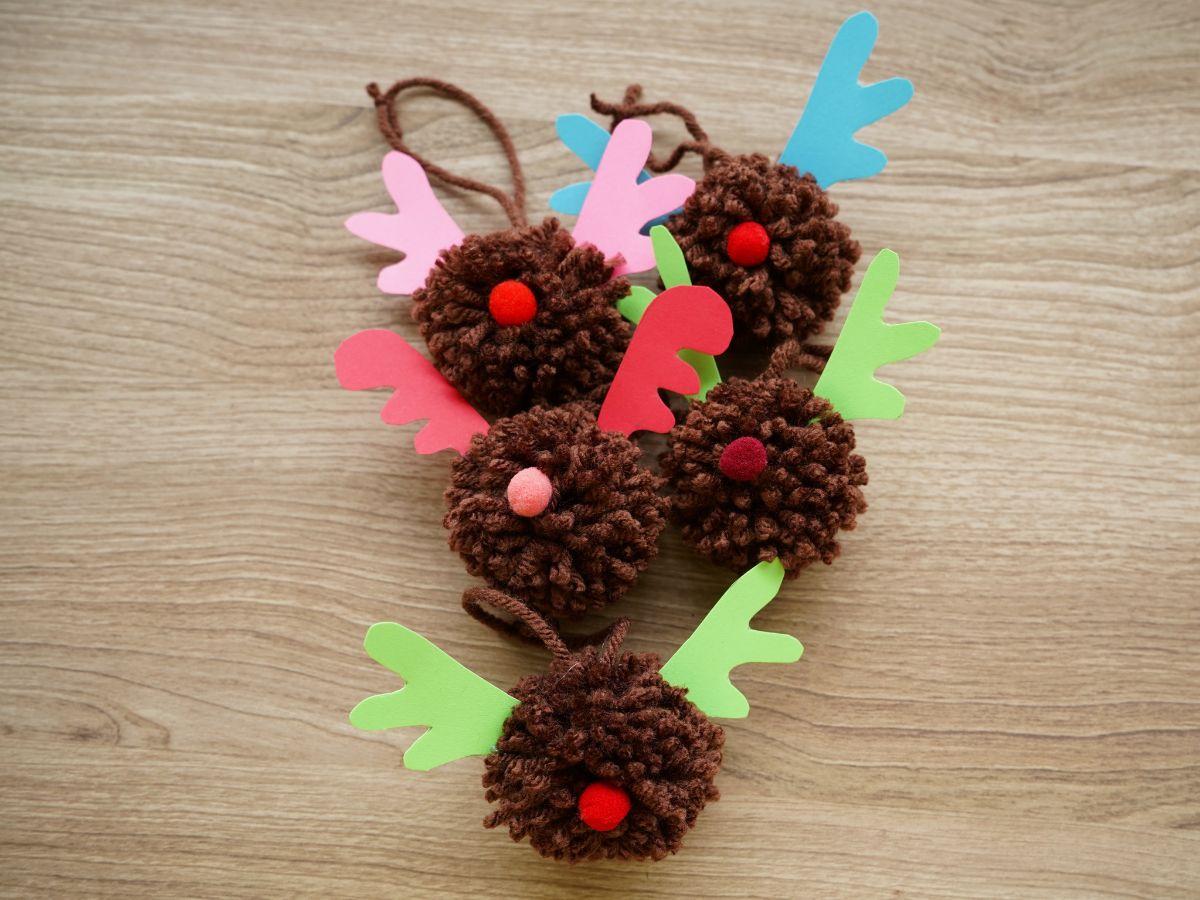 pile of pom pom reindeer Christmas ornaments