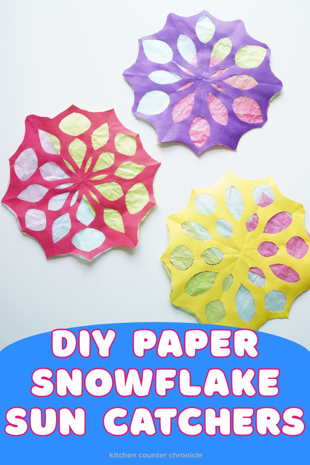 diy paper snowflake sun catchers with title pin