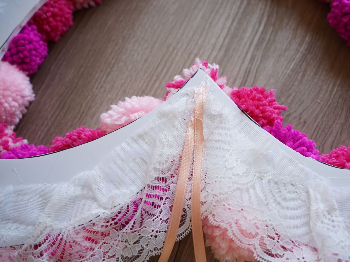 loop of ribbon to hang wreath glued on backside of heart wreath