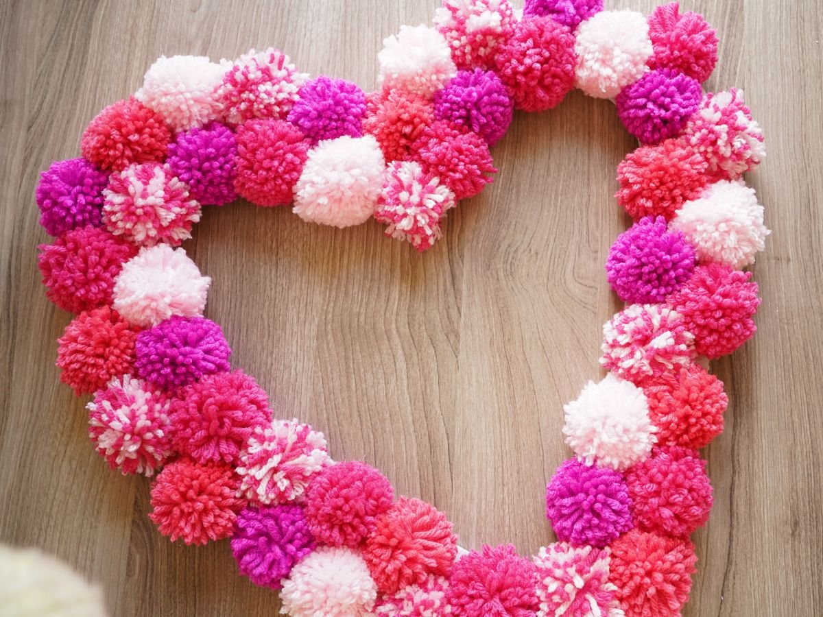 pink pom poms glued on heart wreath form