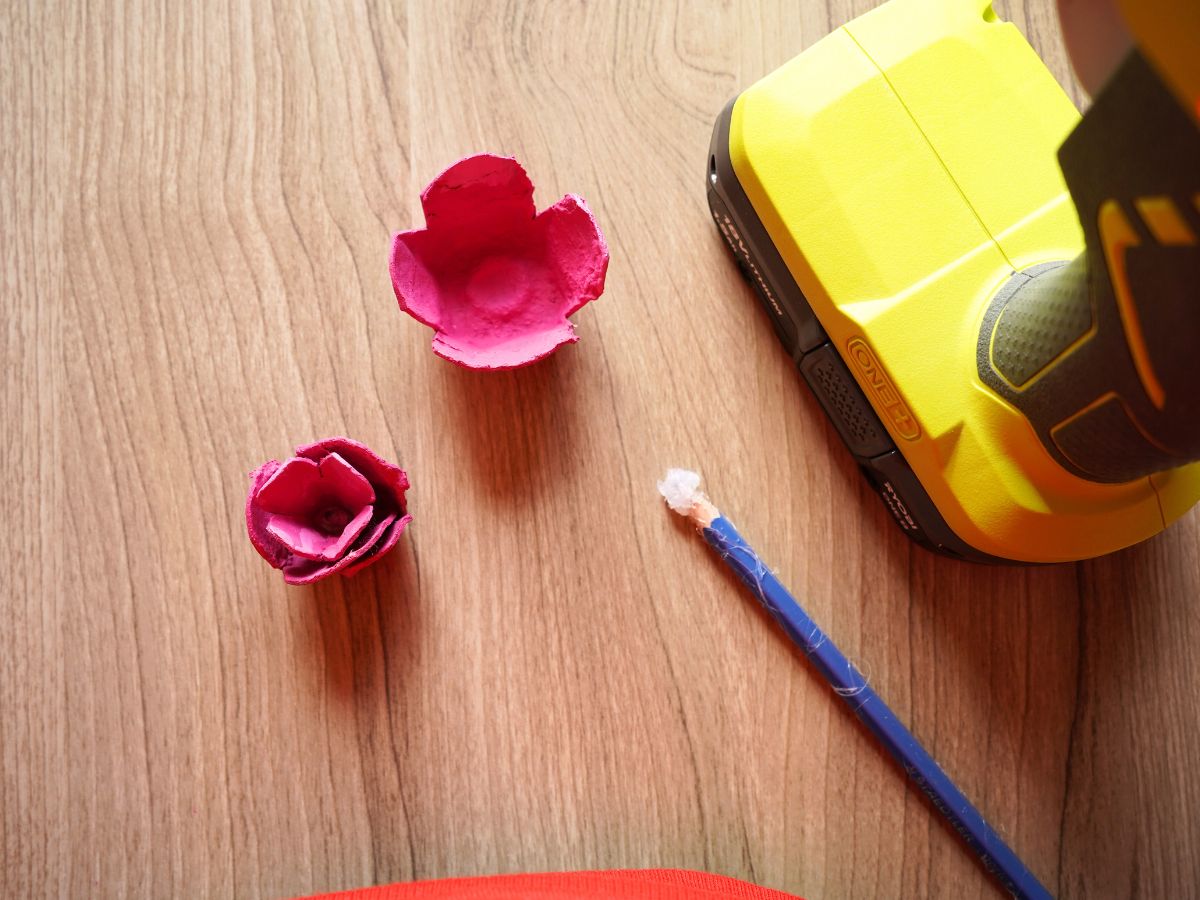 inner layers of egg carton rose being glued together with glue gun