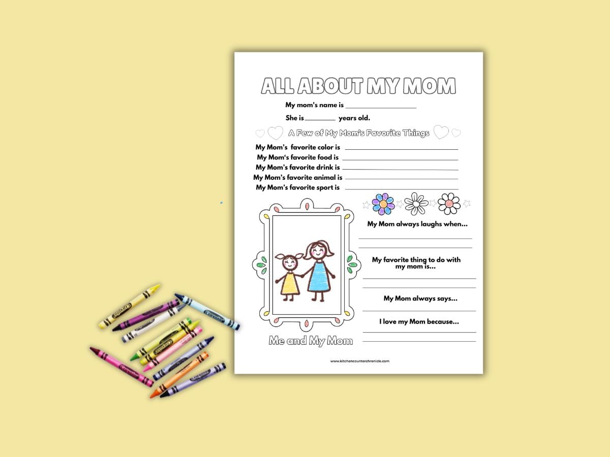 print out of all about mom printable with pile of crayons and some parts colored in on sheet