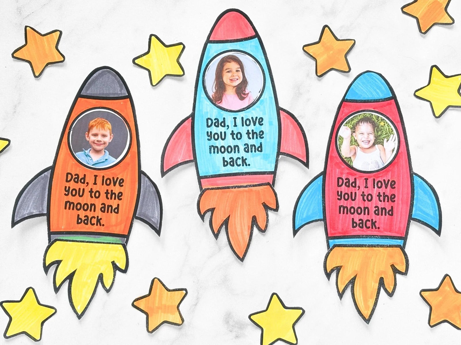 3 printed father's day rocket ships with kids faces inside the window printable