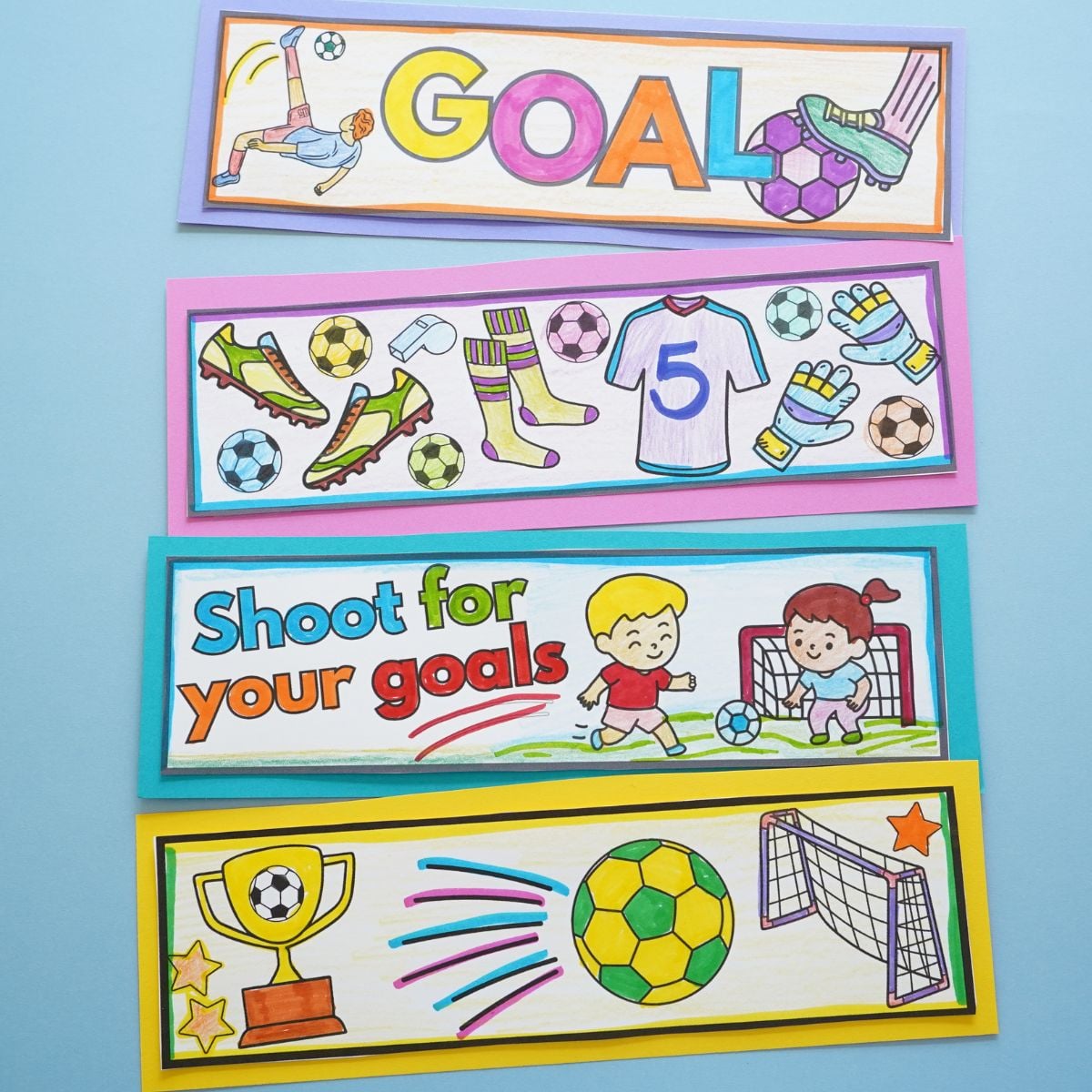 4 colored soccer bookmarks on blue table