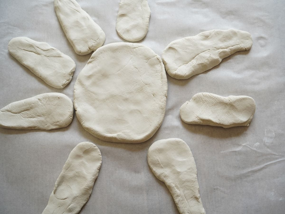 air dry clay shaped into sunflower petals and flower middle