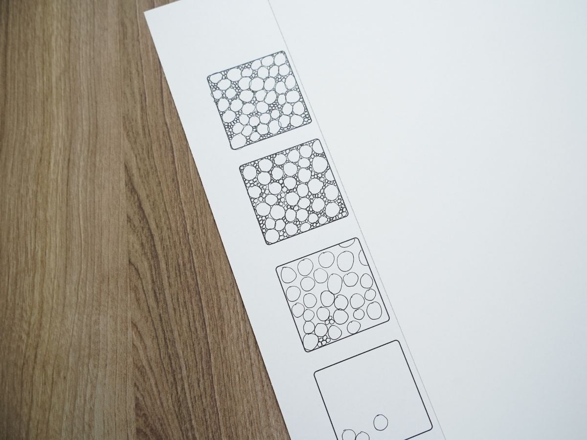 close up of drawing large and small circle zentangle inspired pattern instructions